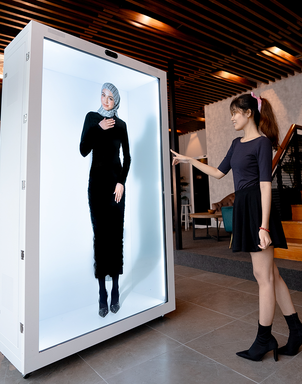Woman interacting with Holome display